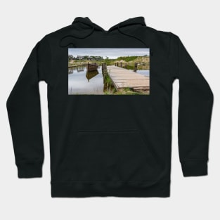 Peaceful landscape with lake and wooden boat Hoodie